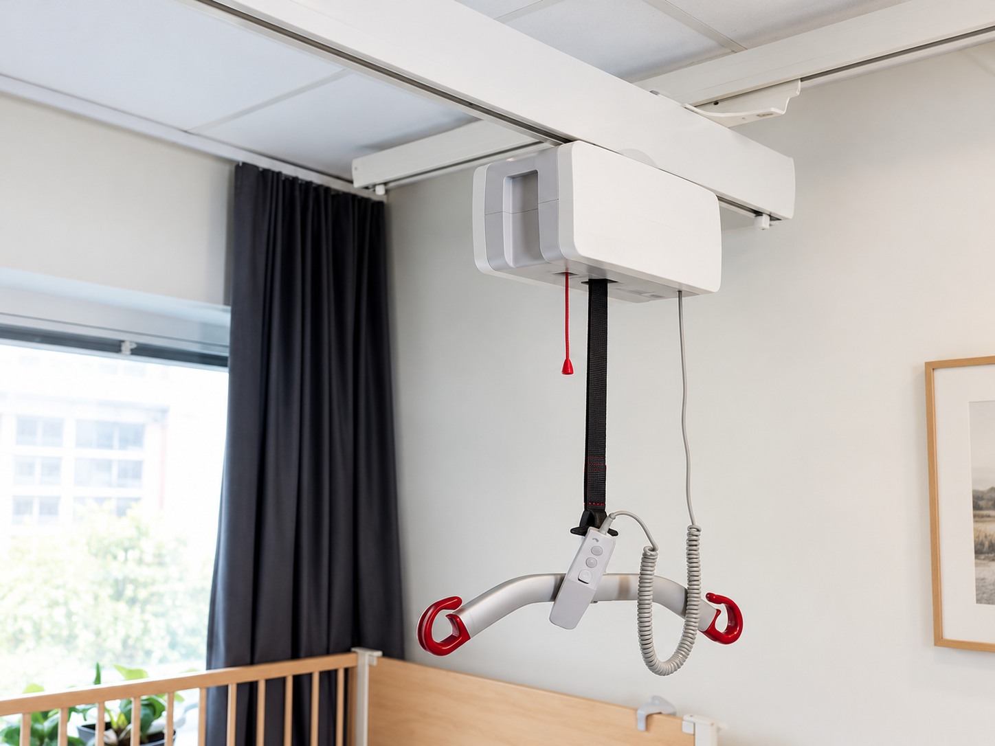 Unbranded ceiling-mounted patient lift with a fabric lifting strap